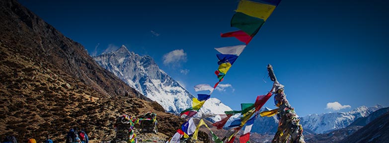 Colorful prayer flags in the Himalayas – Nepal Tour Package from India